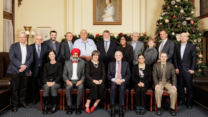Group picture of everyone involved in the Neautrons Canada meeting, in front of a christmas tree